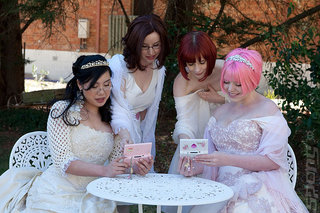 The happy couple and maids of honour play DS.