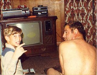 Child & naked man enjoying 80s gaming