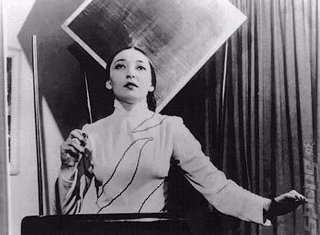 Clara and her Theremin. Go on then Logitech, make one!