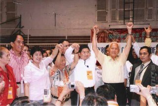Fred Lim celebrates a high score in the video game called 'Politics'.