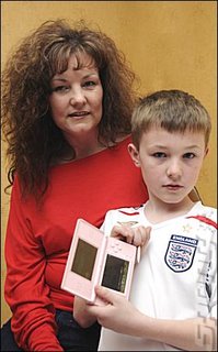 Mother, son and pink DS. (pic via News of the World)